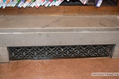 Stone  and metal baseboards that encase radiators at the Minneapolis Franklin Library